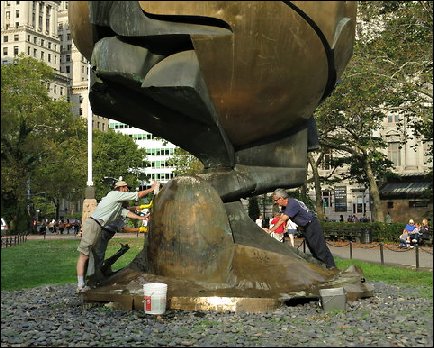 Cleaning the Koenig Sphere Memorial in Battery Park
